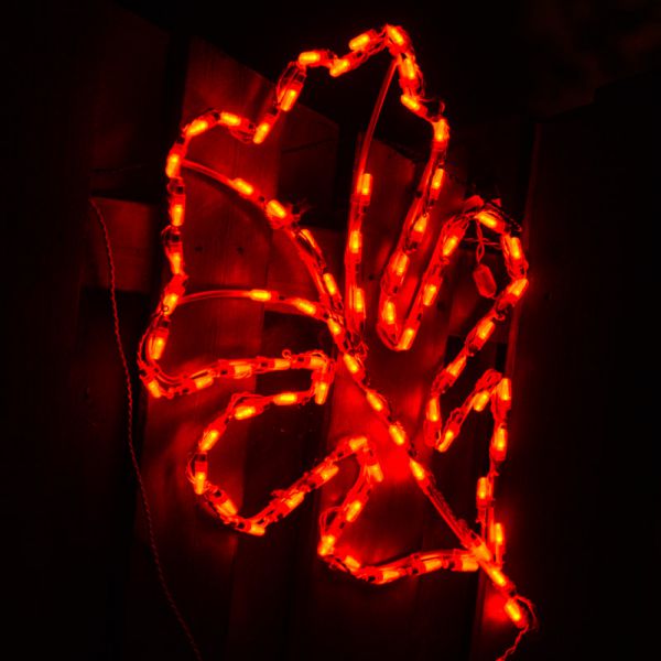 Orange commercial LED oak leaf display glowing on a black studio background