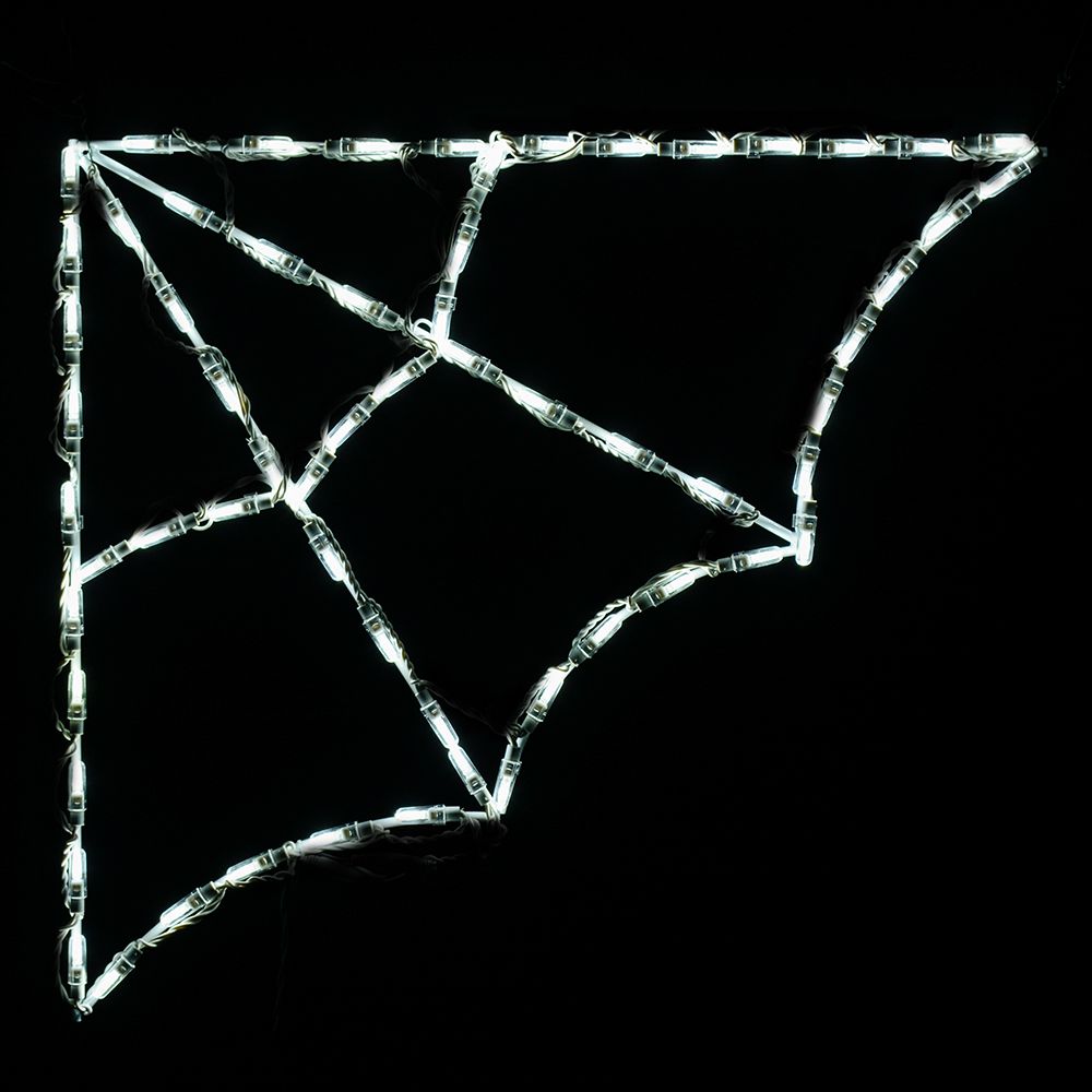 White commercial LED corner spider web display glowing on a dark background